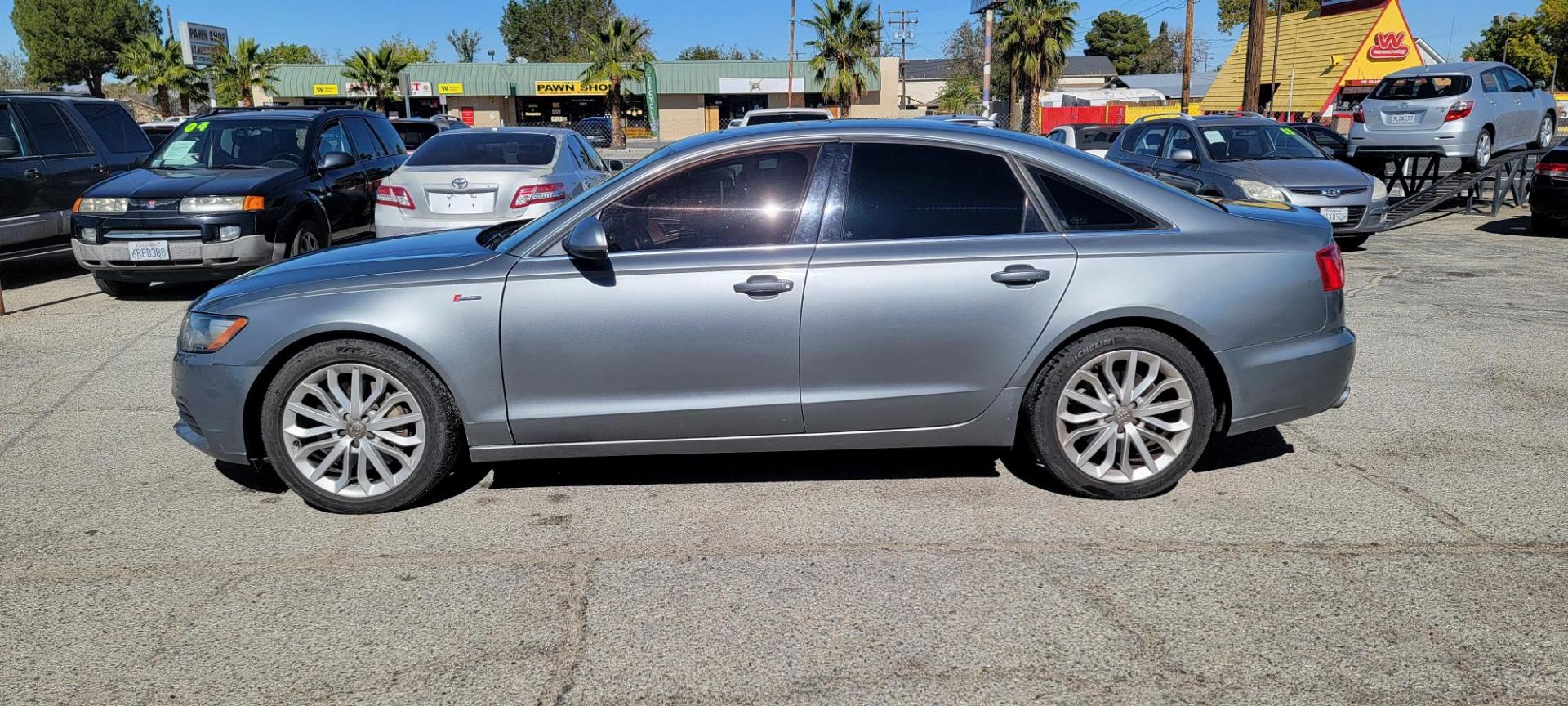 2012 Audi A6 3.0T quattro Tiptronic (WAUGGAFC2CN) with an 3.0L V6 DOHC 24V TURBO engine, 6-Speed Automatic transmission, located at 44356 Date Ave., Lancaster, CA, 93534, (661) 945-6555, 34.688919, -118.139374 - Photo#1